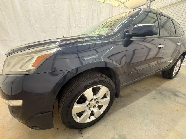 2015 Blue Chevrolet Traverse LS FWD w/PDC (1GNKRFEDXFJ) with an 3.6L V6 DOHC 24V engine, 6-Speed Automatic transmission, located at 1806 Veterans Memorial Hwy SW, Austell, GA, 30168, (770) 944-9558, 33.817959, -84.606987 - Photo#1