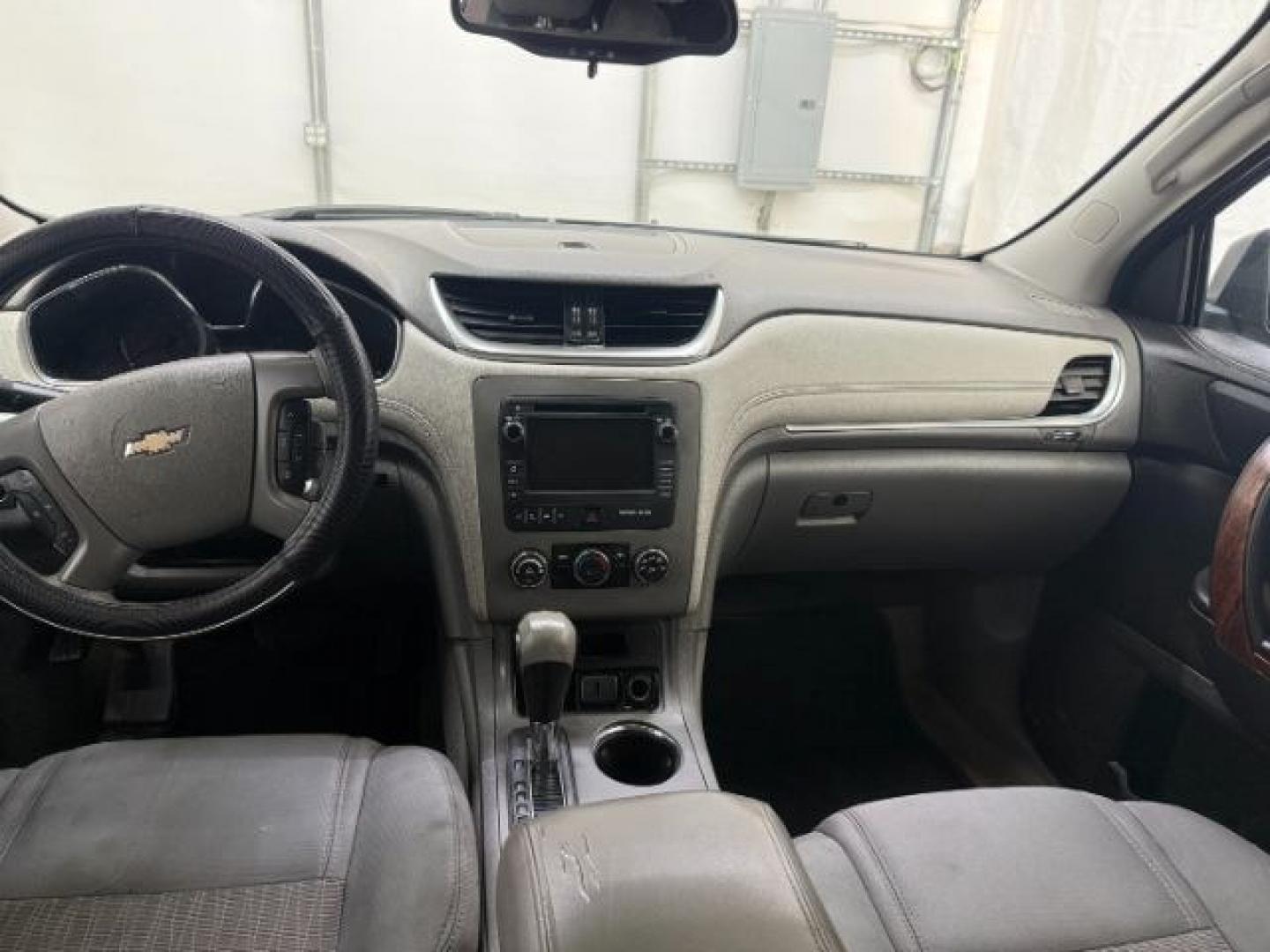 2015 Blue Chevrolet Traverse LS FWD w/PDC (1GNKRFEDXFJ) with an 3.6L V6 DOHC 24V engine, 6-Speed Automatic transmission, located at 1806 Veterans Memorial Hwy SW, Austell, GA, 30168, (770) 944-9558, 33.817959, -84.606987 - Photo#9