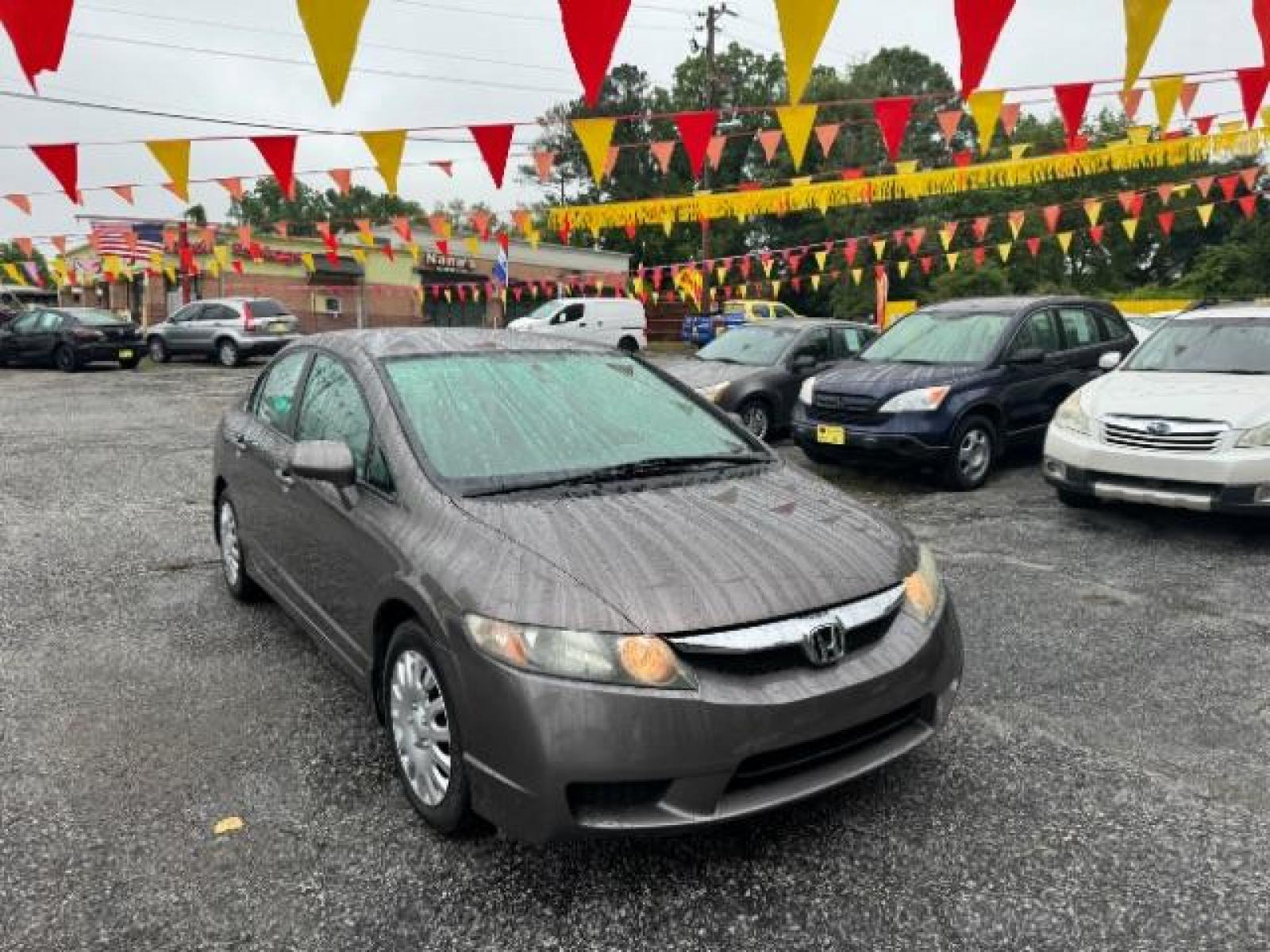 2011 Gray Honda Civic LX Sedan 5-Speed AT (19XFA1F52BE) with an 1.8L L4 SOHC 16V engine, 5-Speed Automatic transmission, located at 1806 Veterans Memorial Hwy SW, Austell, GA, 30168, (770) 944-9558, 33.817959, -84.606987 - Photo #2