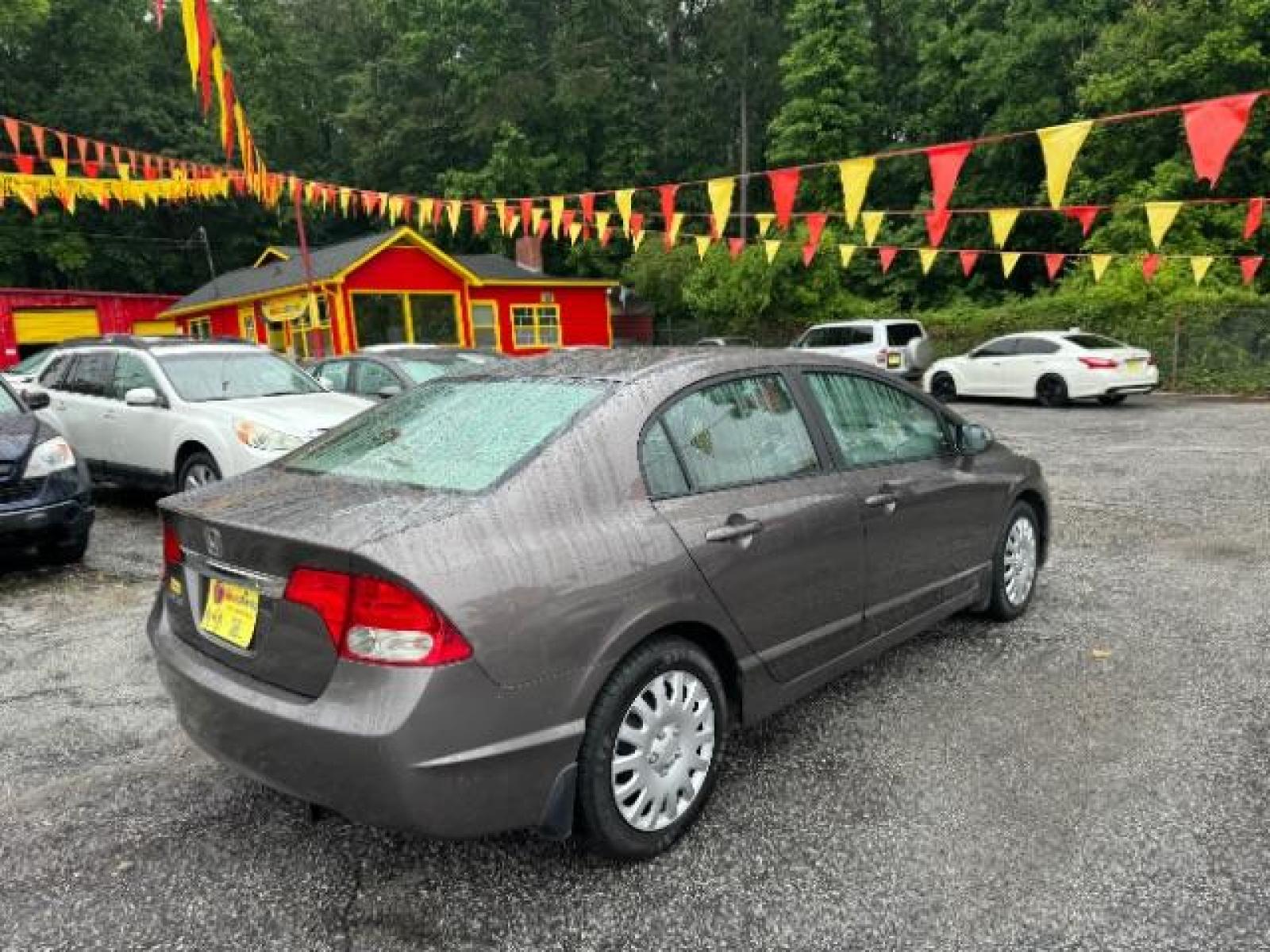2011 Gray Honda Civic LX Sedan 5-Speed AT (19XFA1F52BE) with an 1.8L L4 SOHC 16V engine, 5-Speed Automatic transmission, located at 1806 Veterans Memorial Hwy SW, Austell, GA, 30168, (770) 944-9558, 33.817959, -84.606987 - Photo #3
