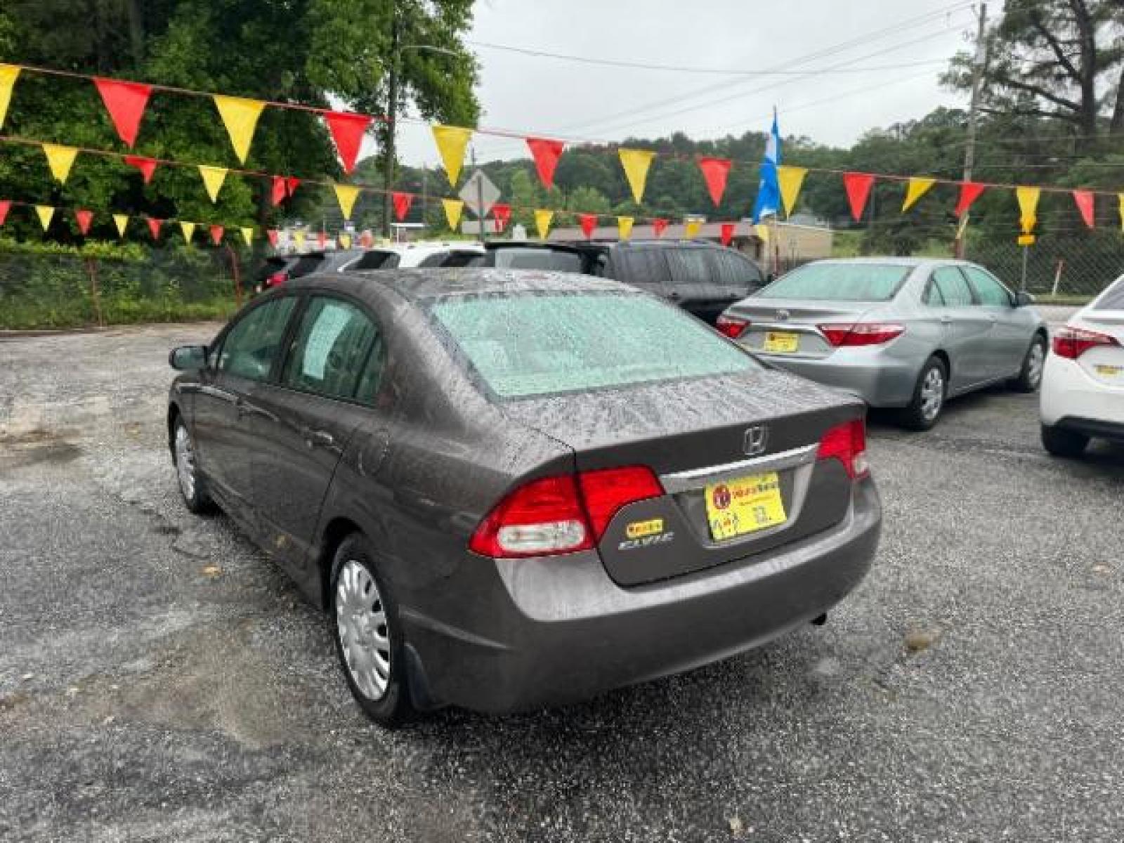2011 Gray Honda Civic LX Sedan 5-Speed AT (19XFA1F52BE) with an 1.8L L4 SOHC 16V engine, 5-Speed Automatic transmission, located at 1806 Veterans Memorial Hwy SW, Austell, GA, 30168, (770) 944-9558, 33.817959, -84.606987 - Photo #5