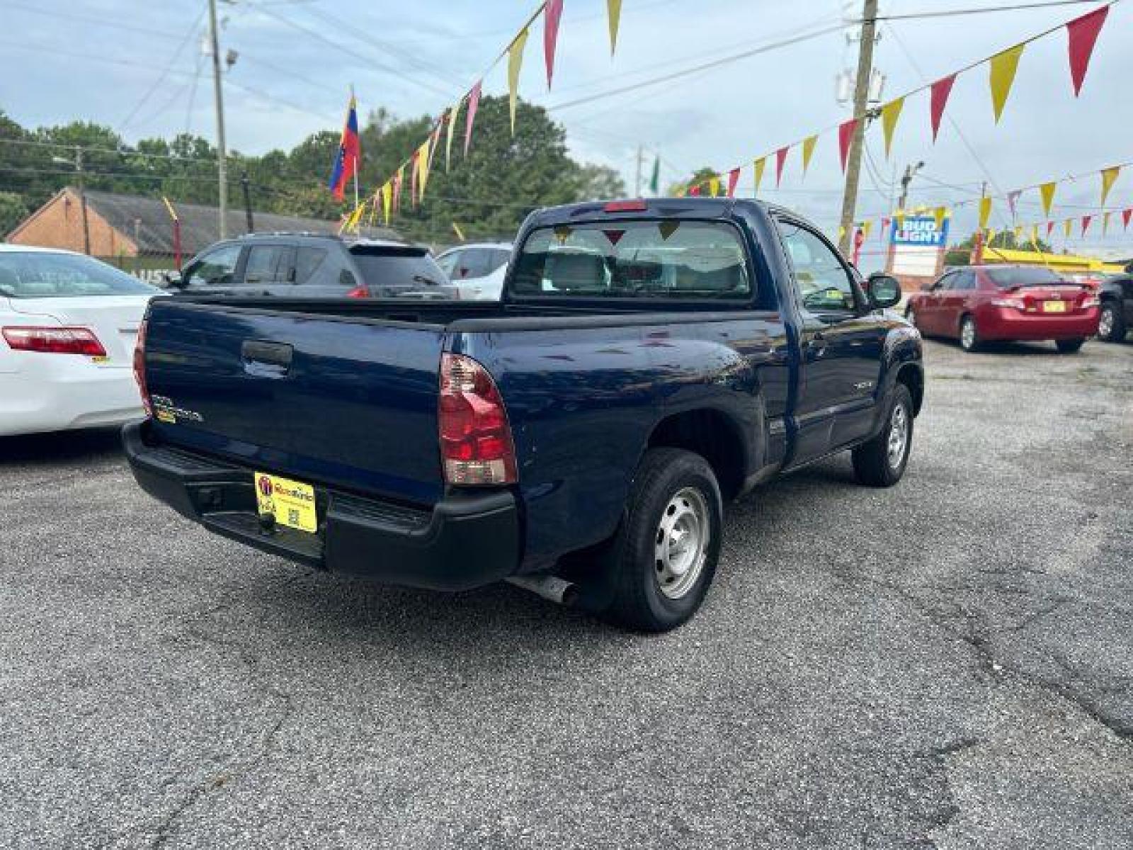 2006 Blue Toyota Tacoma Regular Cab 2WD (5TENX22N36Z) with an 2.7L L4 DOHC 16V engine, 5-Speed Manual transmission, located at 1806 Veterans Memorial Hwy SW, Austell, GA, 30168, (770) 944-9558, 33.817959, -84.606987 - Photo #3
