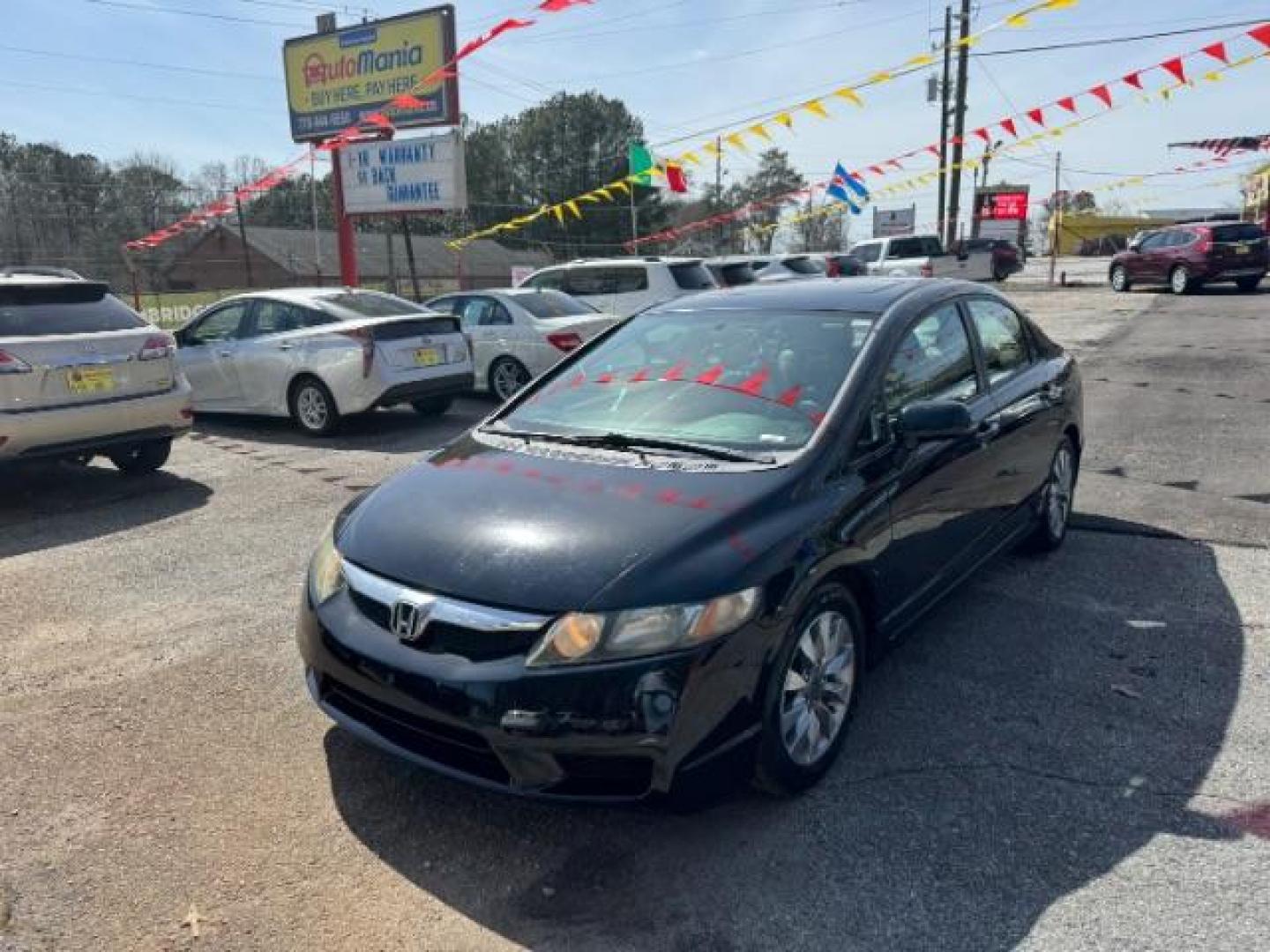 2009 Black Honda Civic EX Sedan 5-Speed AT (2HGFA16859H) with an 1.8L L4 SOHC 16V engine, 5-Speed Automatic transmission, located at 1806 Veterans Memorial Hwy SW, Austell, GA, 30168, (770) 944-9558, 33.817959, -84.606987 - Photo#0