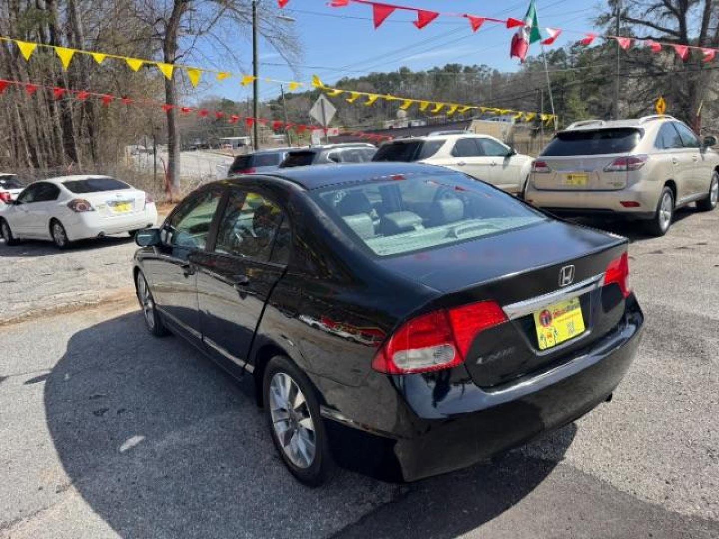 2009 Black Honda Civic EX Sedan 5-Speed AT (2HGFA16859H) with an 1.8L L4 SOHC 16V engine, 5-Speed Automatic transmission, located at 1806 Veterans Memorial Hwy SW, Austell, GA, 30168, (770) 944-9558, 33.817959, -84.606987 - Photo#5