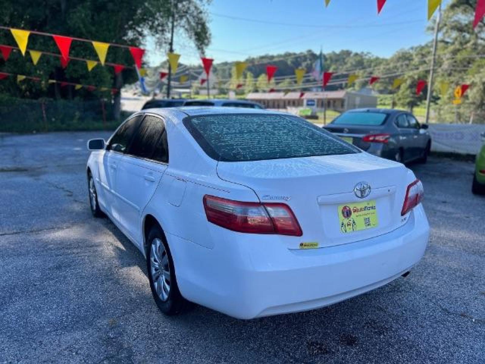 2009 White Toyota Camry LE 5-Spd AT (4T1BE46KX9U) with an 2.4L L4 DOHC 16V engine, 5-Speed Automatic transmission, located at 1806 Veterans Memorial Hwy SW, Austell, GA, 30168, (770) 944-9558, 33.817959, -84.606987 - Photo #5