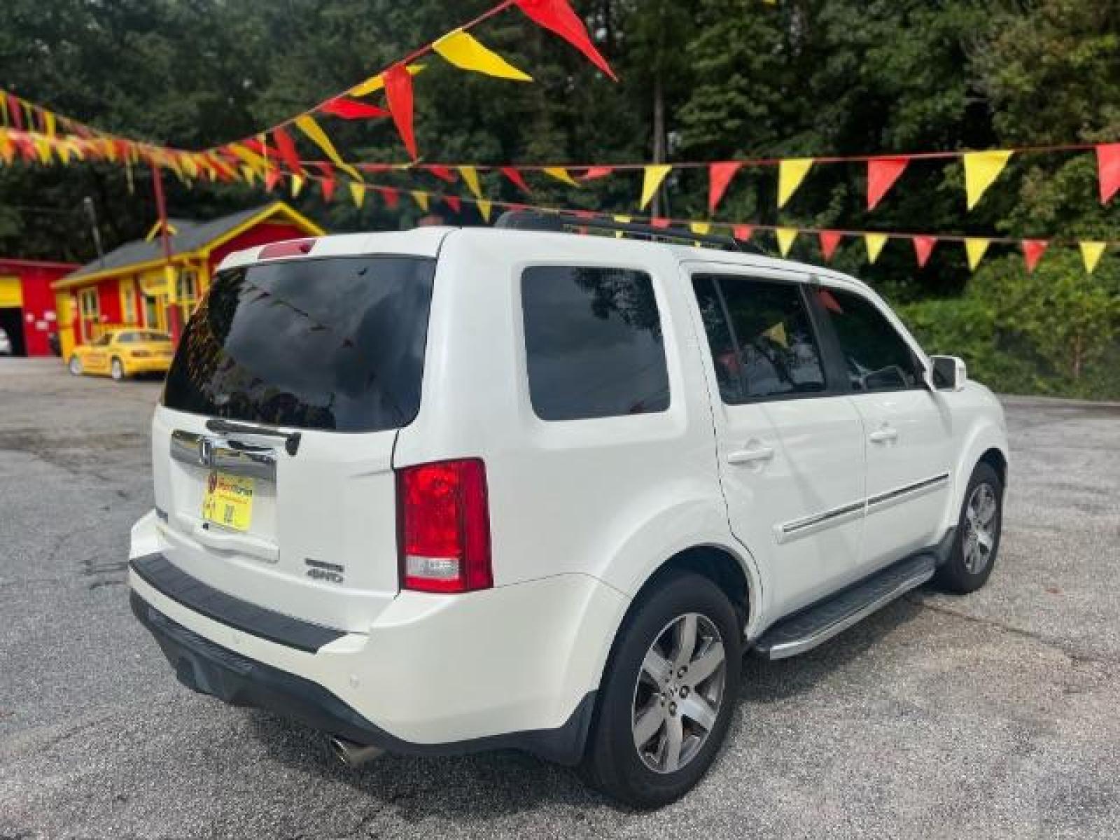 2012 White Honda Pilot Touring 4WD 5-Spd AT with DVD (5FNYF4H9XCB) with an 3.5L V6 SOHC 24V engine, 5-Speed Automatic transmission, located at 1806 Veterans Memorial Hwy SW, Austell, GA, 30168, (770) 944-9558, 33.817959, -84.606987 - Photo #3