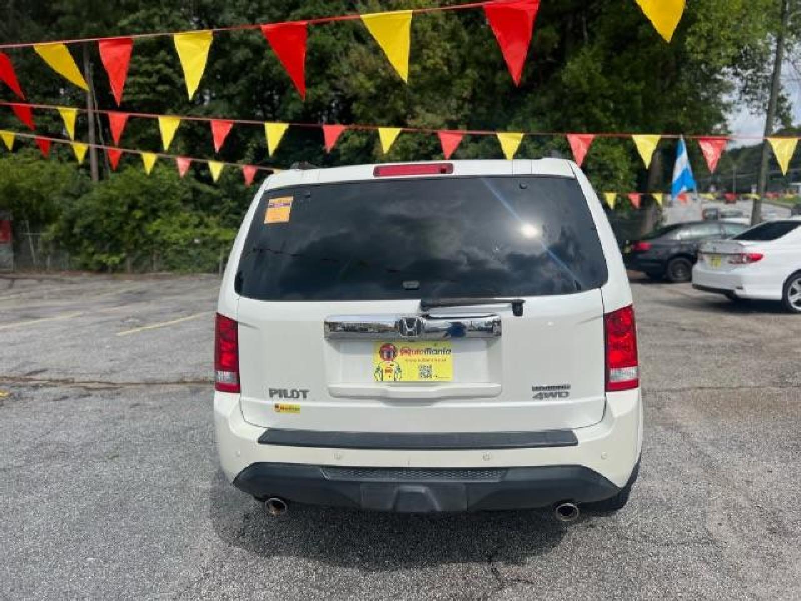 2012 White Honda Pilot Touring 4WD 5-Spd AT with DVD (5FNYF4H9XCB) with an 3.5L V6 SOHC 24V engine, 5-Speed Automatic transmission, located at 1806 Veterans Memorial Hwy SW, Austell, GA, 30168, (770) 944-9558, 33.817959, -84.606987 - Photo #4