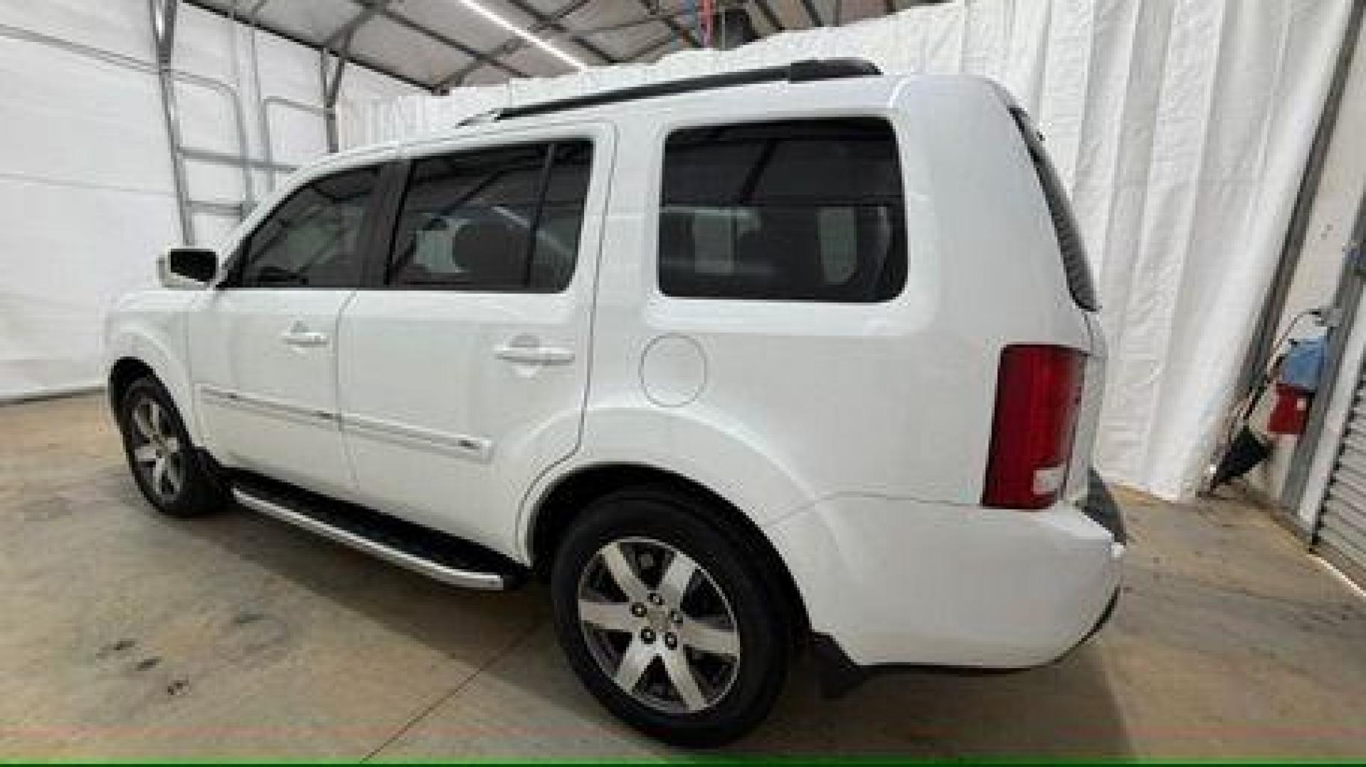 2012 White Honda Pilot Touring 4WD 5-Spd AT (5FNYF4H9XCB) with an 3.5L V6 SOHC 24V engine, 5-Speed Automatic transmission, located at 1806 Veterans Memorial Hwy SW, Austell, GA, 30168, (770) 944-9558, 33.817959, -84.606987 - Photo#2