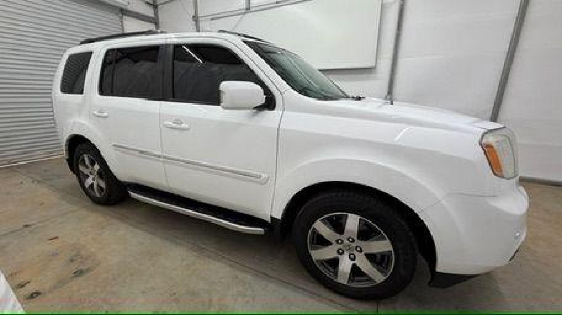 2012 White Honda Pilot Touring 4WD 5-Spd AT (5FNYF4H9XCB) with an 3.5L V6 SOHC 24V engine, 5-Speed Automatic transmission, located at 1806 Veterans Memorial Hwy SW, Austell, GA, 30168, (770) 944-9558, 33.817959, -84.606987 - Photo#7