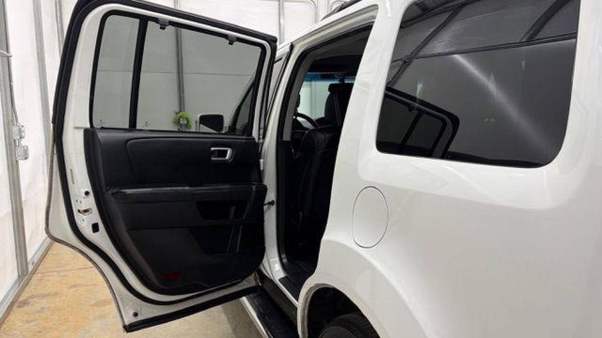 2012 White Honda Pilot Touring 4WD 5-Spd AT (5FNYF4H9XCB) with an 3.5L V6 SOHC 24V engine, 5-Speed Automatic transmission, located at 1806 Veterans Memorial Hwy SW, Austell, GA, 30168, (770) 944-9558, 33.817959, -84.606987 - Photo#13
