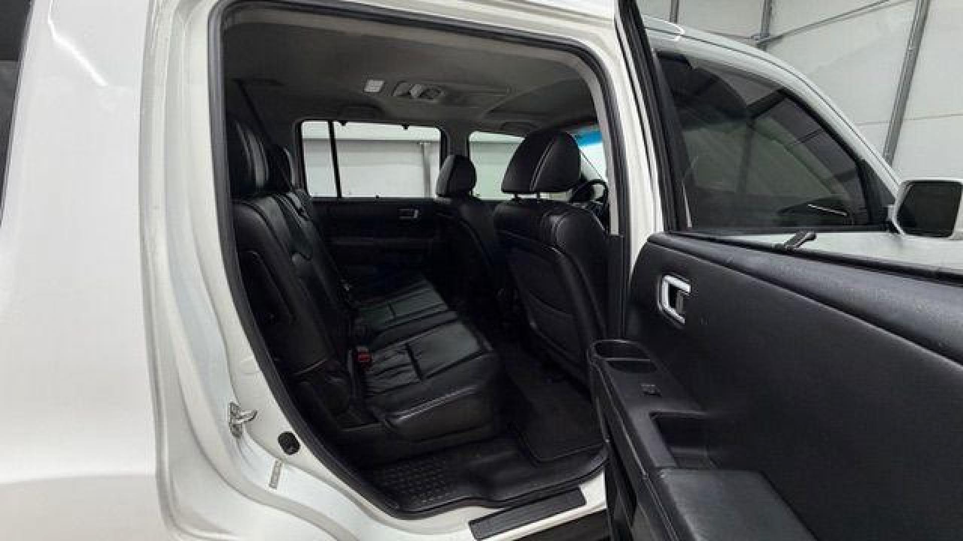 2012 White Honda Pilot Touring 4WD 5-Spd AT (5FNYF4H9XCB) with an 3.5L V6 SOHC 24V engine, 5-Speed Automatic transmission, located at 1806 Veterans Memorial Hwy SW, Austell, GA, 30168, (770) 944-9558, 33.817959, -84.606987 - Photo#18