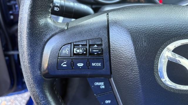 2012 Blue Mazda MAZDA3 I Grand Touring 4-Door (JM1BL1W76C1) with an 2.0L L4 DOHC 16V engine, located at 1806 Veterans Memorial Hwy SW, Austell, GA, 30168, (770) 944-9558, 33.817959, -84.606987- Photo#11