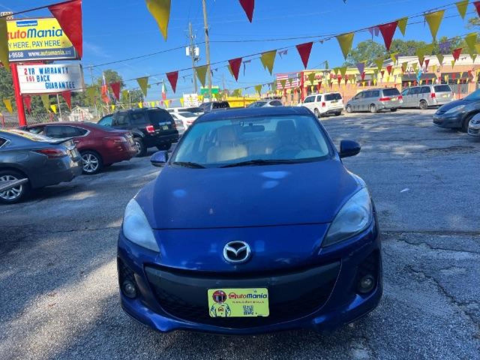 2012 Blue Mazda MAZDA3 I Grand Touring 4-Door (JM1BL1W76C1) with an 2.0L L4 DOHC 16V engine, located at 1806 Veterans Memorial Hwy SW, Austell, GA, 30168, (770) 944-9558, 33.817959, -84.606987 - Photo #1