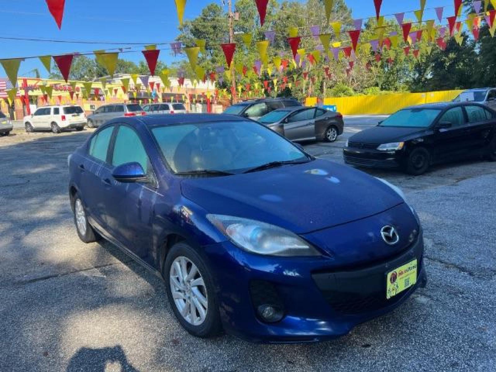 2012 Blue Mazda MAZDA3 I Grand Touring 4-Door (JM1BL1W76C1) with an 2.0L L4 DOHC 16V engine, located at 1806 Veterans Memorial Hwy SW, Austell, GA, 30168, (770) 944-9558, 33.817959, -84.606987 - Photo #2