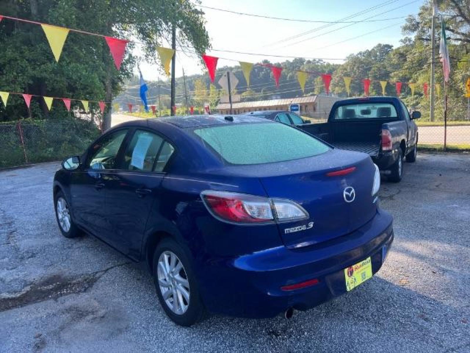 2012 Blue Mazda MAZDA3 I Grand Touring 4-Door (JM1BL1W76C1) with an 2.0L L4 DOHC 16V engine, located at 1806 Veterans Memorial Hwy SW, Austell, GA, 30168, (770) 944-9558, 33.817959, -84.606987 - Photo #5