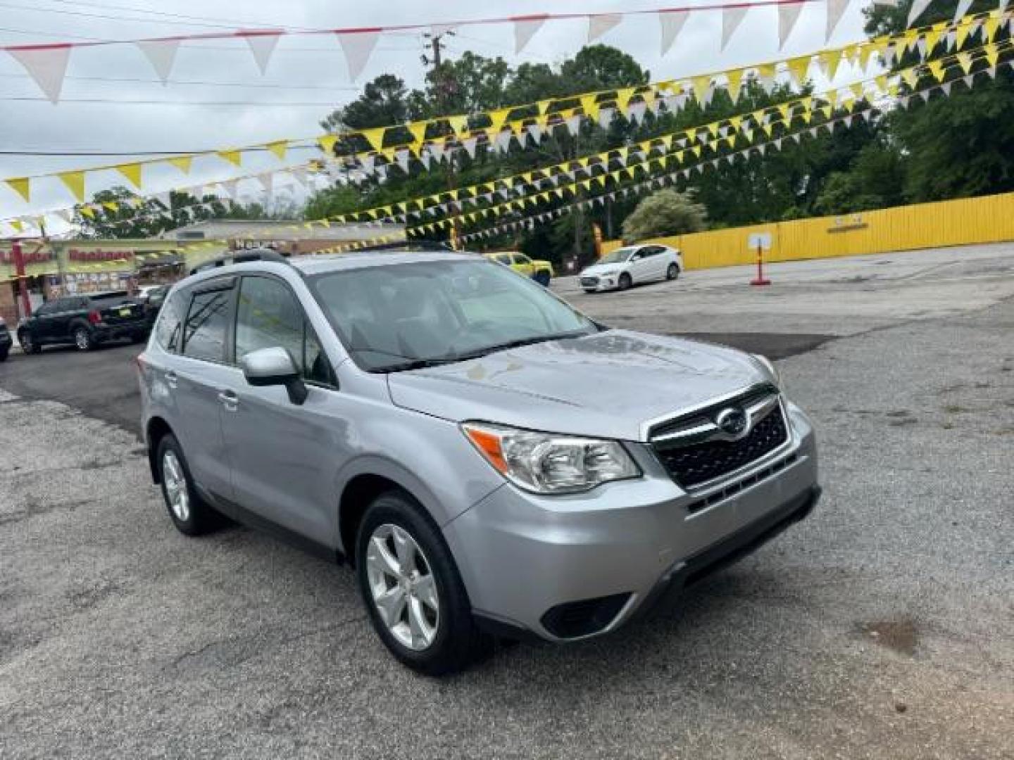 2016 Silver Subaru Forester 2.5i Premium PZEV CV (JF2SJADC1GH) with an 2.5L H4 SOHC 16V engine, Continuously Variabl transmission, located at 1806 Veterans Memorial Hwy SW, Austell, GA, 30168, (770) 944-9558, 33.817959, -84.606987 - Photo#1