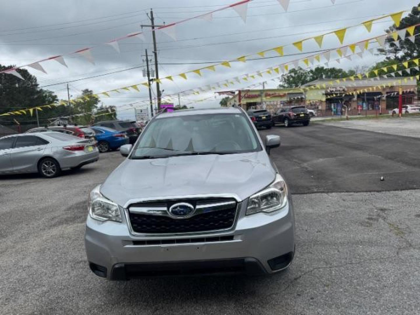 2016 Silver Subaru Forester 2.5i Premium PZEV CV (JF2SJADC1GH) with an 2.5L H4 SOHC 16V engine, Continuously Variabl transmission, located at 1806 Veterans Memorial Hwy SW, Austell, GA, 30168, (770) 944-9558, 33.817959, -84.606987 - Photo#2