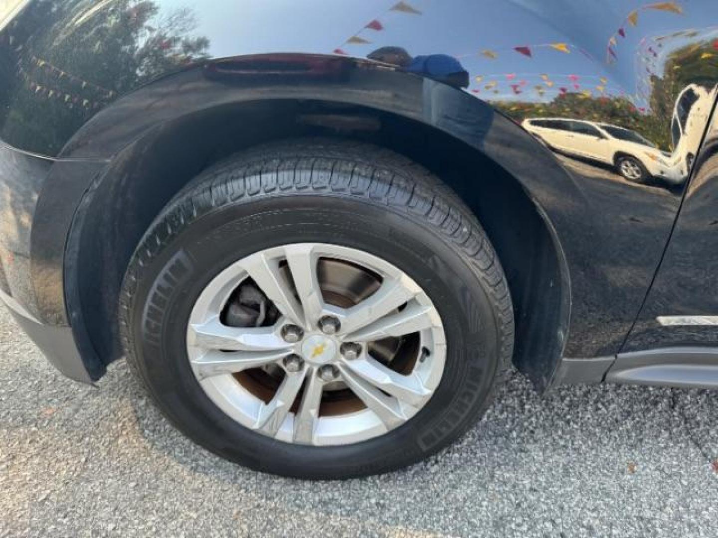 2014 Black Chevrolet Equinox 1LT 2WD (2GNALBEK9E1) with an 2.4L L4 DOHC 16V FFV engine, 6-Speed Automatic transmission, located at 1806 Veterans Memorial Hwy SW, Austell, GA, 30168, (770) 944-9558, 33.817959, -84.606987 - Photo#22