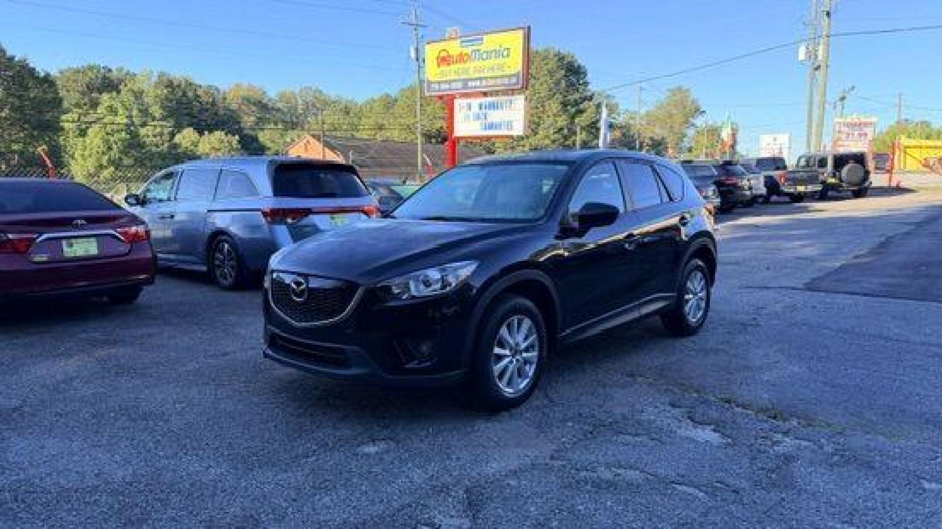 2014 Black Mazda CX-5 Touring (JM3KE2CY3E0) with an 2.5L L4 DOHC 16V engine, 6-Speed Automatic transmission, located at 1806 Veterans Memorial Hwy SW, Austell, GA, 30168, (770) 944-9558, 33.817959, -84.606987 - Photo#0