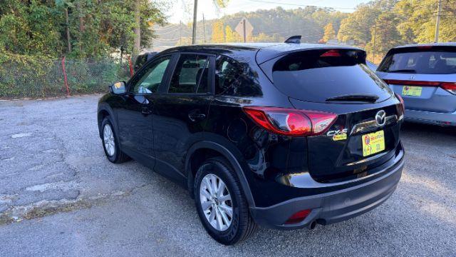 2014 Black Mazda CX-5 Touring (JM3KE2CY3E0) with an 2.5L L4 DOHC 16V engine, 6-Speed Automatic transmission, located at 1806 Veterans Memorial Hwy SW, Austell, GA, 30168, (770) 944-9558, 33.817959, -84.606987 - Photo#5