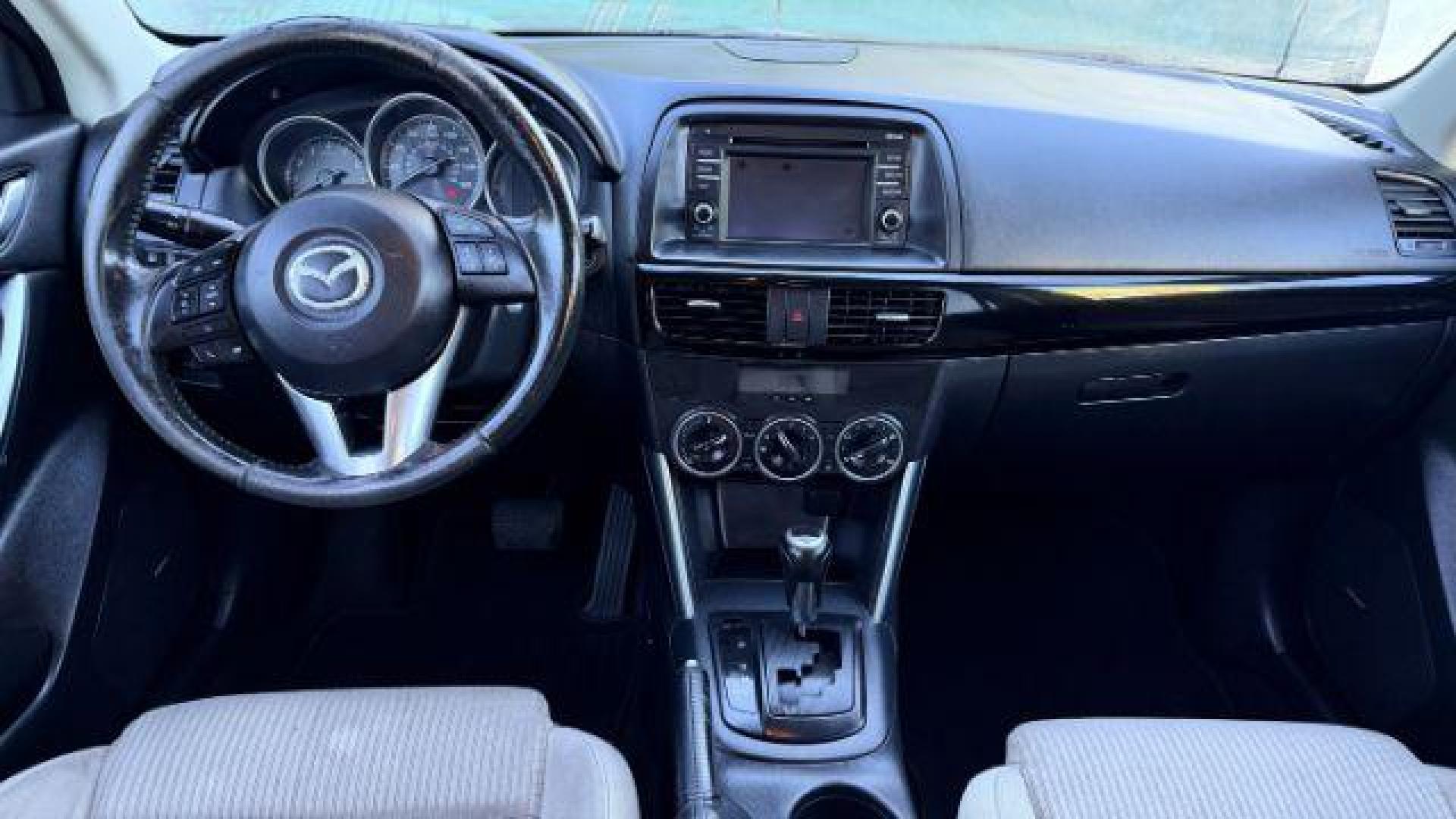 2014 Black Mazda CX-5 Touring (JM3KE2CY3E0) with an 2.5L L4 DOHC 16V engine, 6-Speed Automatic transmission, located at 1806 Veterans Memorial Hwy SW, Austell, GA, 30168, (770) 944-9558, 33.817959, -84.606987 - Photo#8