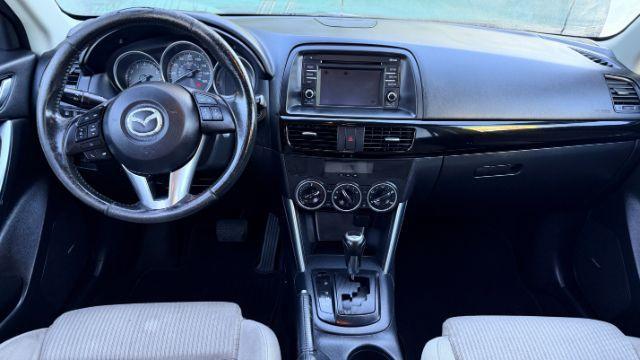 2014 Black Mazda CX-5 Touring (JM3KE2CY3E0) with an 2.5L L4 DOHC 16V engine, 6-Speed Automatic transmission, located at 1806 Veterans Memorial Hwy SW, Austell, GA, 30168, (770) 944-9558, 33.817959, -84.606987 - Photo#8