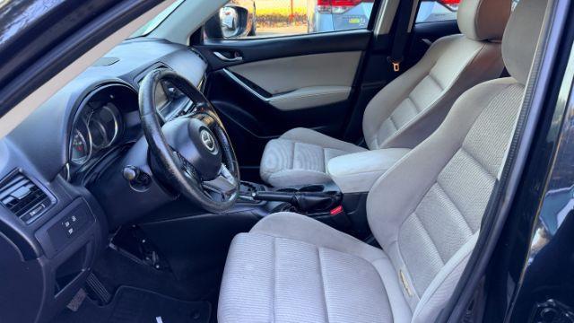 2014 Black Mazda CX-5 Touring (JM3KE2CY3E0) with an 2.5L L4 DOHC 16V engine, 6-Speed Automatic transmission, located at 1806 Veterans Memorial Hwy SW, Austell, GA, 30168, (770) 944-9558, 33.817959, -84.606987 - Photo#9