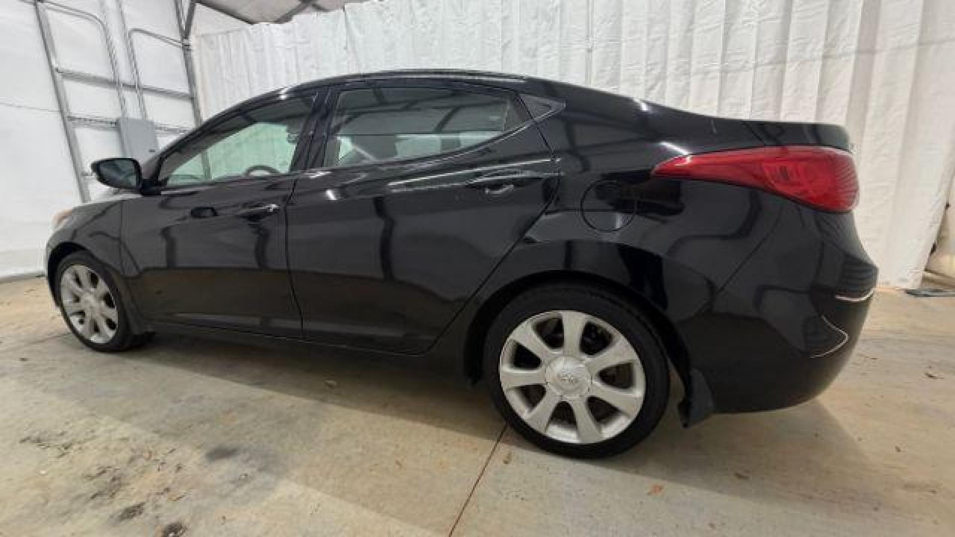 2013 Black Hyundai Elantra GLS A/T (KMHDH4AE3DU) with an 1.8L L4 DOHC 16V engine, 6-Speed Automatic transmission, located at 1806 Veterans Memorial Hwy SW, Austell, GA, 30168, (770) 944-9558, 33.817959, -84.606987 - Photo#2