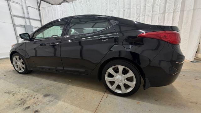 2013 Black Hyundai Elantra GLS A/T (KMHDH4AE3DU) with an 1.8L L4 DOHC 16V engine, 6-Speed Automatic transmission, located at 1806 Veterans Memorial Hwy SW, Austell, GA, 30168, (770) 944-9558, 33.817959, -84.606987 - Photo#2