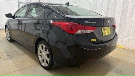 2013 Black Hyundai Elantra GLS A/T (KMHDH4AE3DU) with an 1.8L L4 DOHC 16V engine, 6-Speed Automatic transmission, located at 1806 Veterans Memorial Hwy SW, Austell, GA, 30168, (770) 944-9558, 33.817959, -84.606987 - Photo#3