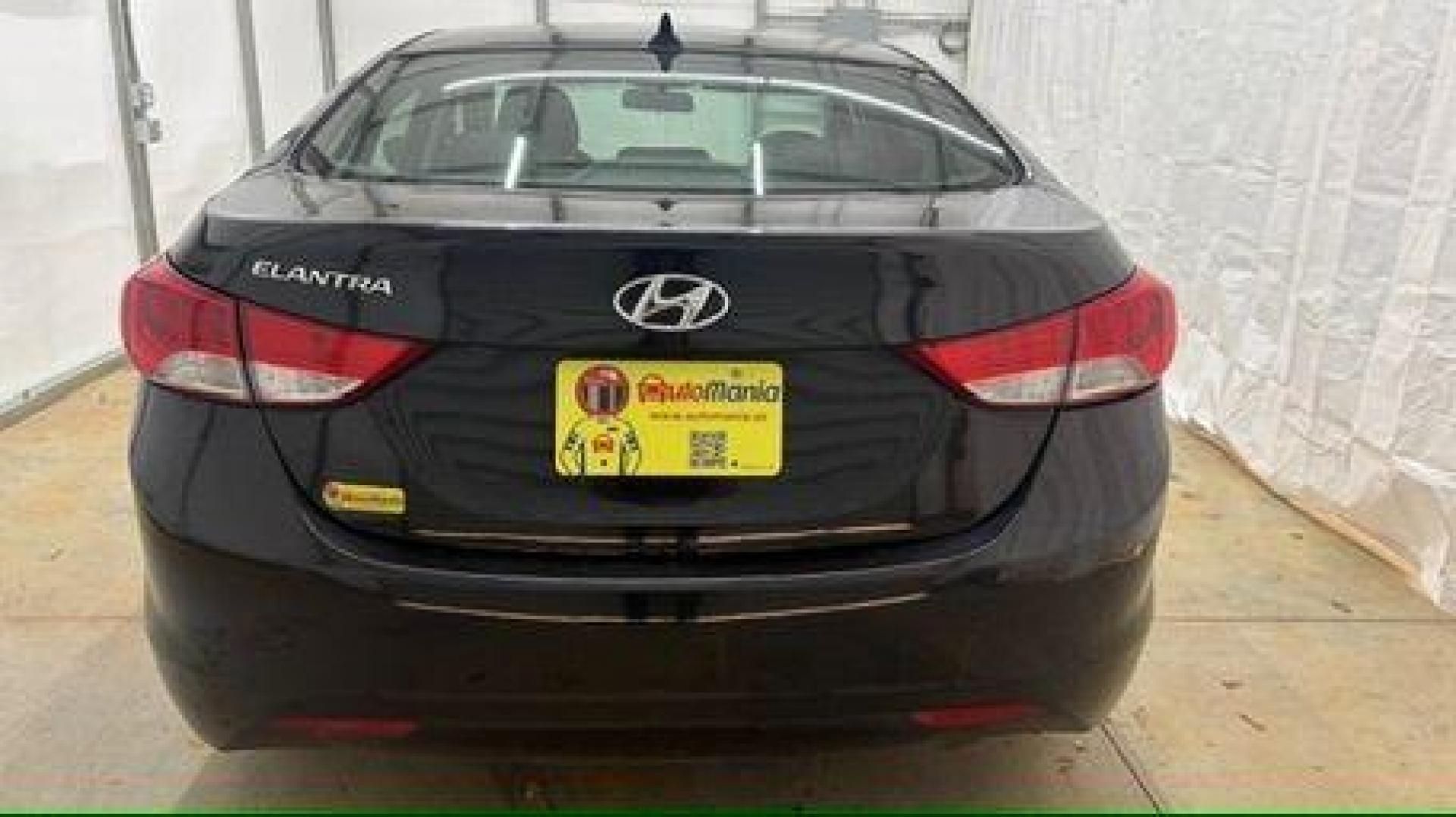 2013 Black Hyundai Elantra GLS A/T (KMHDH4AE3DU) with an 1.8L L4 DOHC 16V engine, 6-Speed Automatic transmission, located at 1806 Veterans Memorial Hwy SW, Austell, GA, 30168, (770) 944-9558, 33.817959, -84.606987 - Photo#4