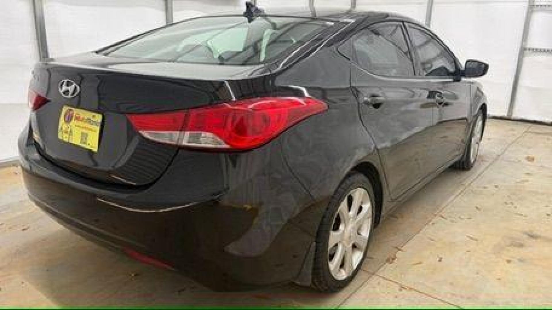 2013 Black Hyundai Elantra GLS A/T (KMHDH4AE3DU) with an 1.8L L4 DOHC 16V engine, 6-Speed Automatic transmission, located at 1806 Veterans Memorial Hwy SW, Austell, GA, 30168, (770) 944-9558, 33.817959, -84.606987 - Photo#5