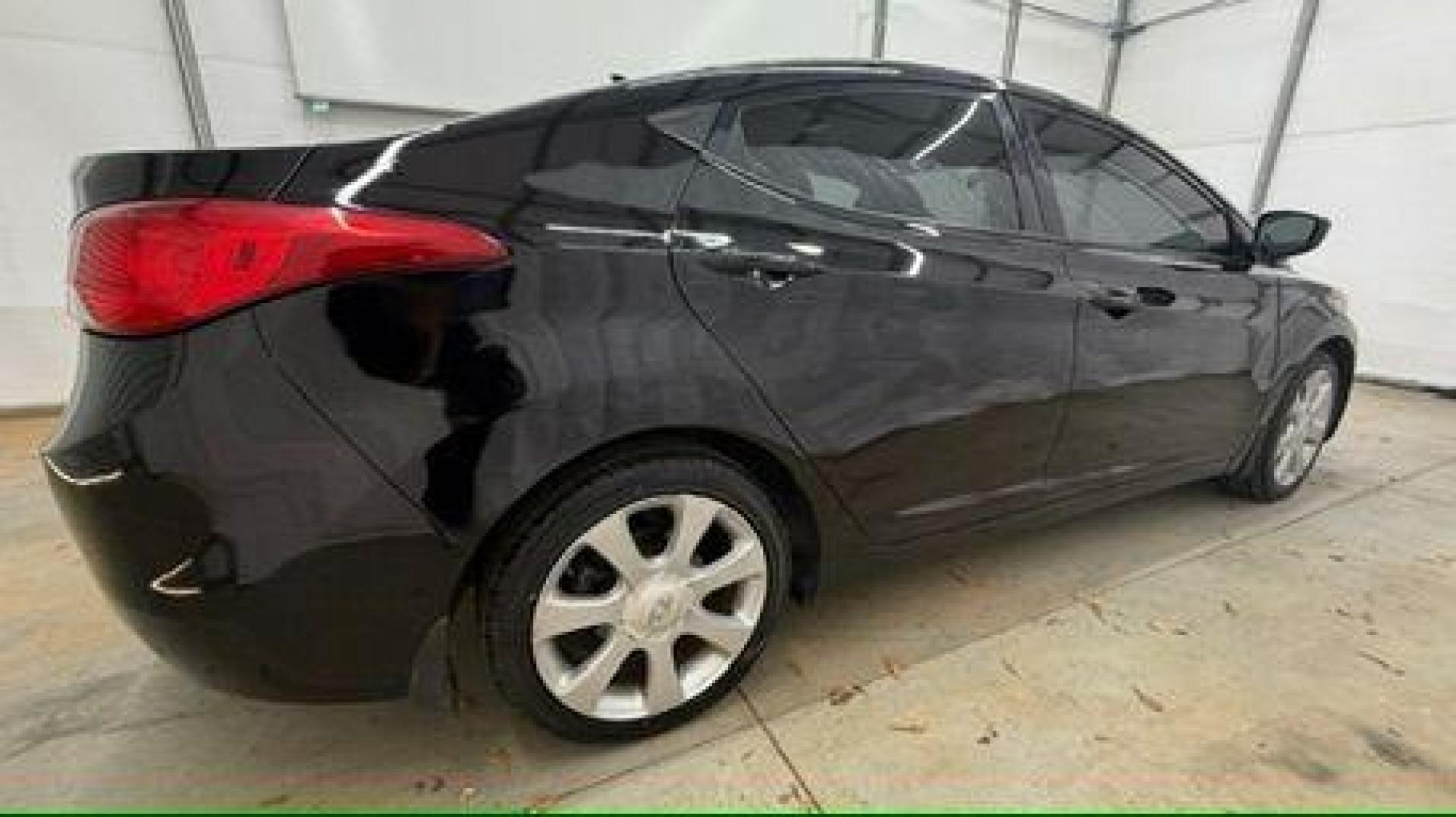 2013 Black Hyundai Elantra GLS A/T (KMHDH4AE3DU) with an 1.8L L4 DOHC 16V engine, 6-Speed Automatic transmission, located at 1806 Veterans Memorial Hwy SW, Austell, GA, 30168, (770) 944-9558, 33.817959, -84.606987 - Photo#6