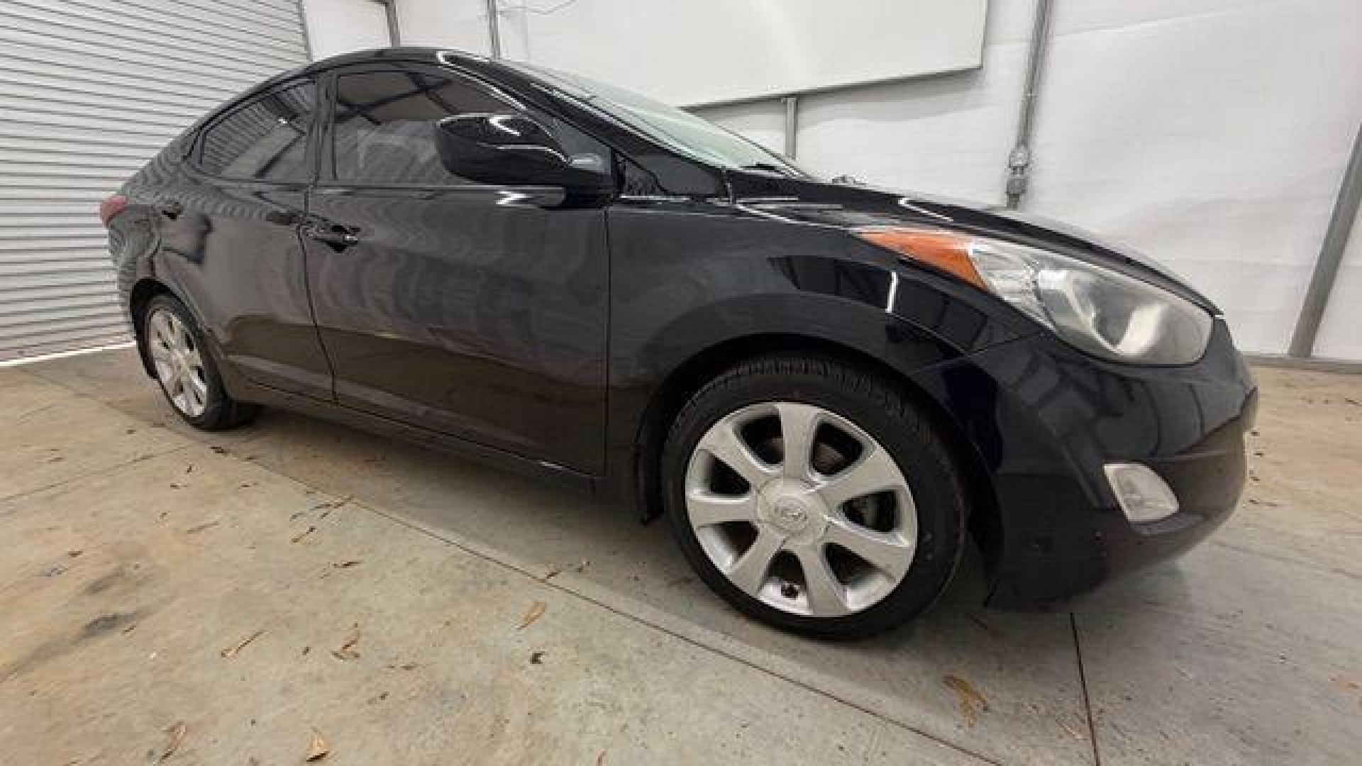 2013 Black Hyundai Elantra GLS A/T (KMHDH4AE3DU) with an 1.8L L4 DOHC 16V engine, 6-Speed Automatic transmission, located at 1806 Veterans Memorial Hwy SW, Austell, GA, 30168, (770) 944-9558, 33.817959, -84.606987 - Photo#7