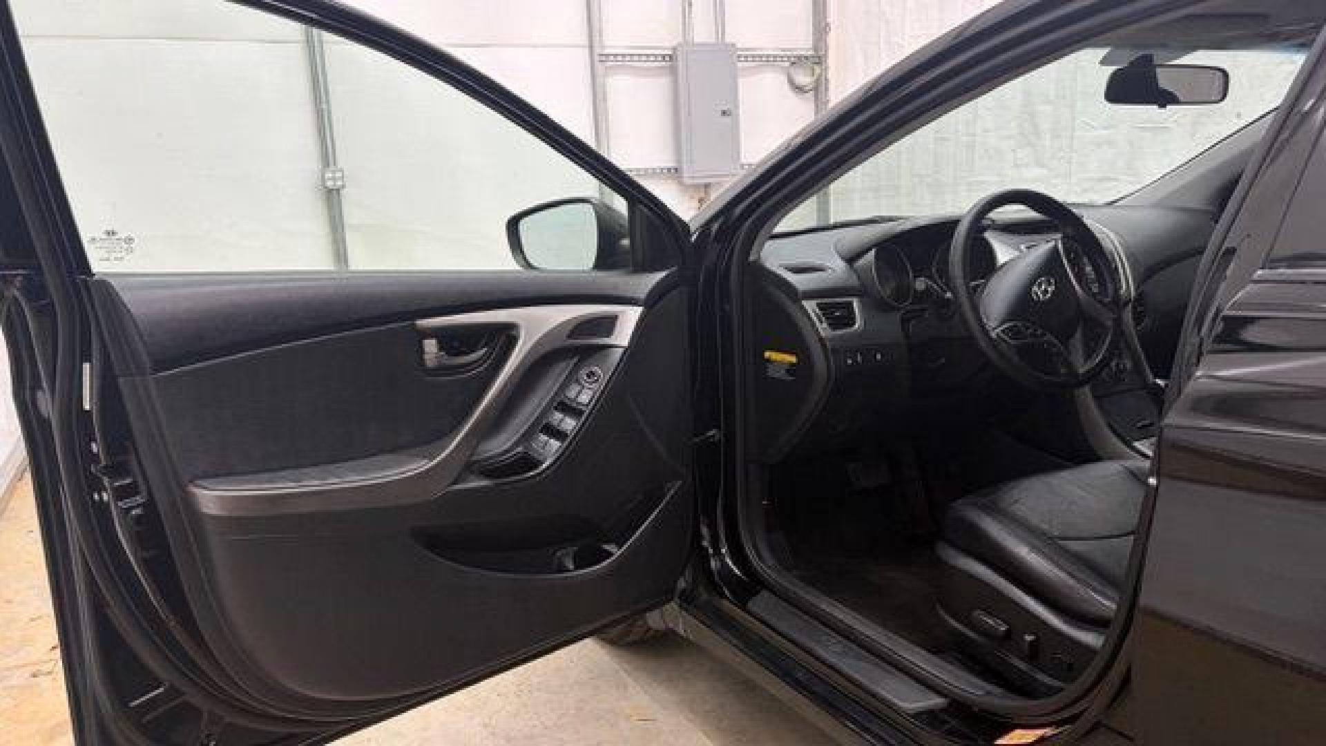 2013 Black Hyundai Elantra GLS A/T (KMHDH4AE3DU) with an 1.8L L4 DOHC 16V engine, 6-Speed Automatic transmission, located at 1806 Veterans Memorial Hwy SW, Austell, GA, 30168, (770) 944-9558, 33.817959, -84.606987 - Photo#10