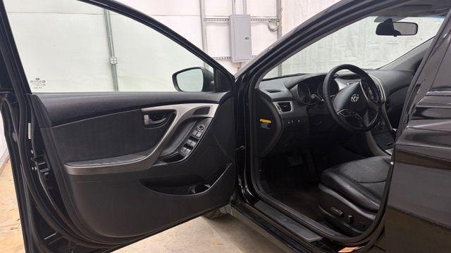 2013 Black Hyundai Elantra GLS A/T (KMHDH4AE3DU) with an 1.8L L4 DOHC 16V engine, 6-Speed Automatic transmission, located at 1806 Veterans Memorial Hwy SW, Austell, GA, 30168, (770) 944-9558, 33.817959, -84.606987 - Photo#10