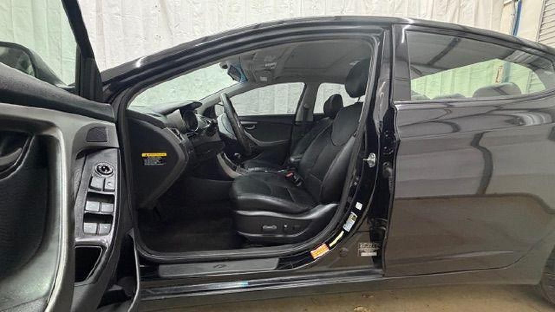 2013 Black Hyundai Elantra GLS A/T (KMHDH4AE3DU) with an 1.8L L4 DOHC 16V engine, 6-Speed Automatic transmission, located at 1806 Veterans Memorial Hwy SW, Austell, GA, 30168, (770) 944-9558, 33.817959, -84.606987 - Photo#12