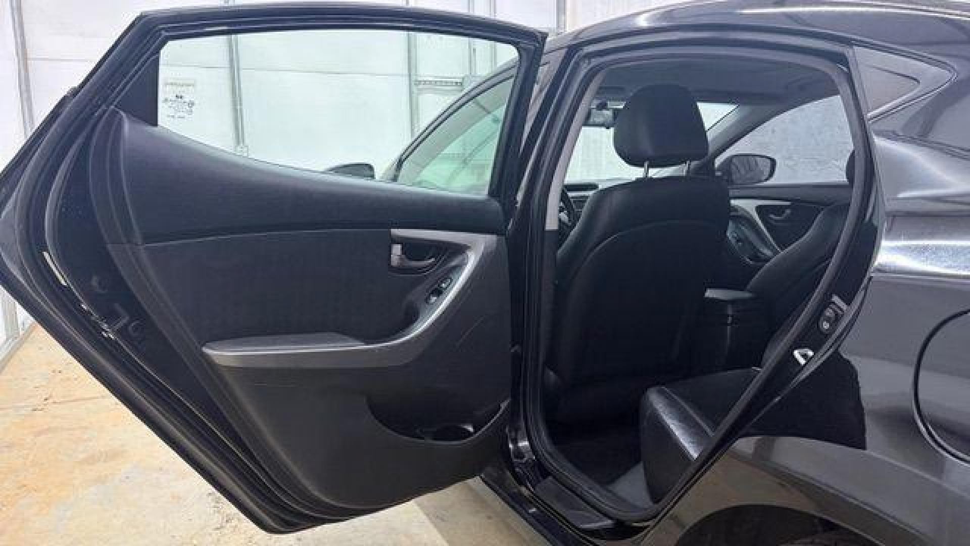 2013 Black Hyundai Elantra GLS A/T (KMHDH4AE3DU) with an 1.8L L4 DOHC 16V engine, 6-Speed Automatic transmission, located at 1806 Veterans Memorial Hwy SW, Austell, GA, 30168, (770) 944-9558, 33.817959, -84.606987 - Photo#13