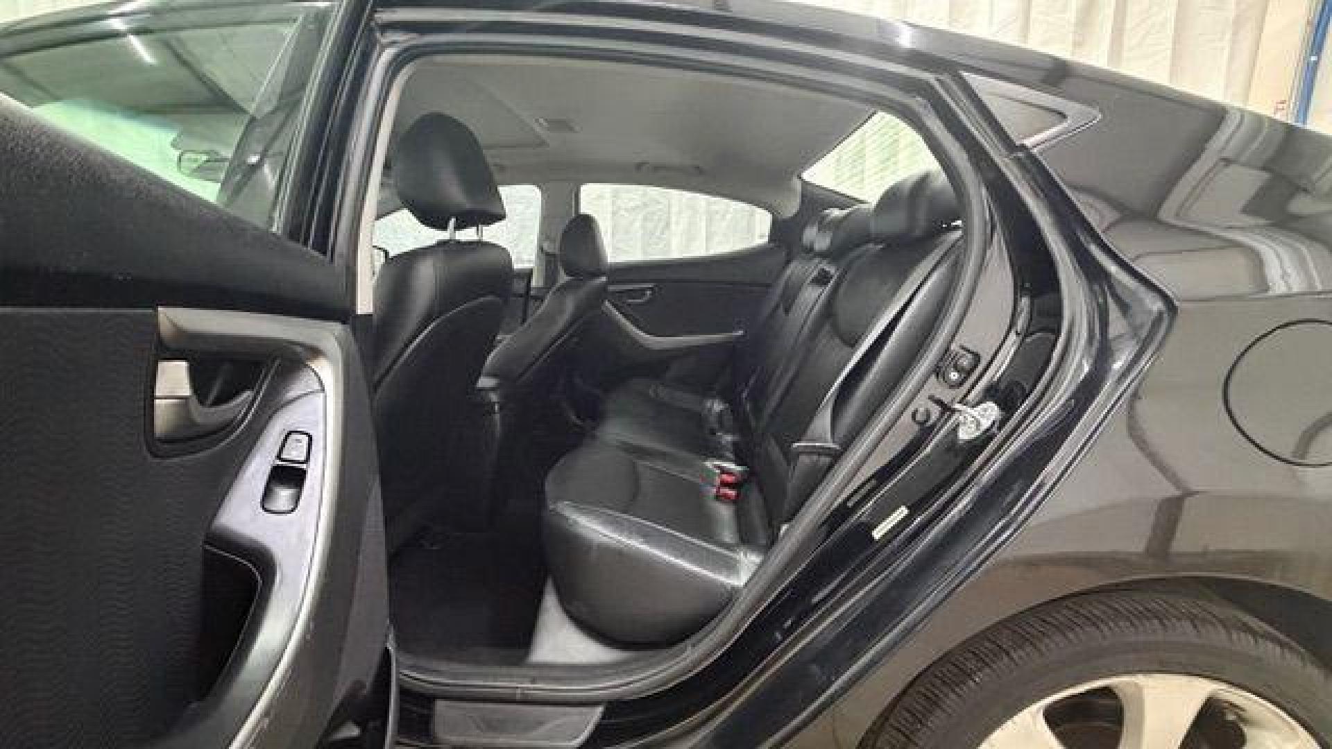 2013 Black Hyundai Elantra GLS A/T (KMHDH4AE3DU) with an 1.8L L4 DOHC 16V engine, 6-Speed Automatic transmission, located at 1806 Veterans Memorial Hwy SW, Austell, GA, 30168, (770) 944-9558, 33.817959, -84.606987 - Photo#14