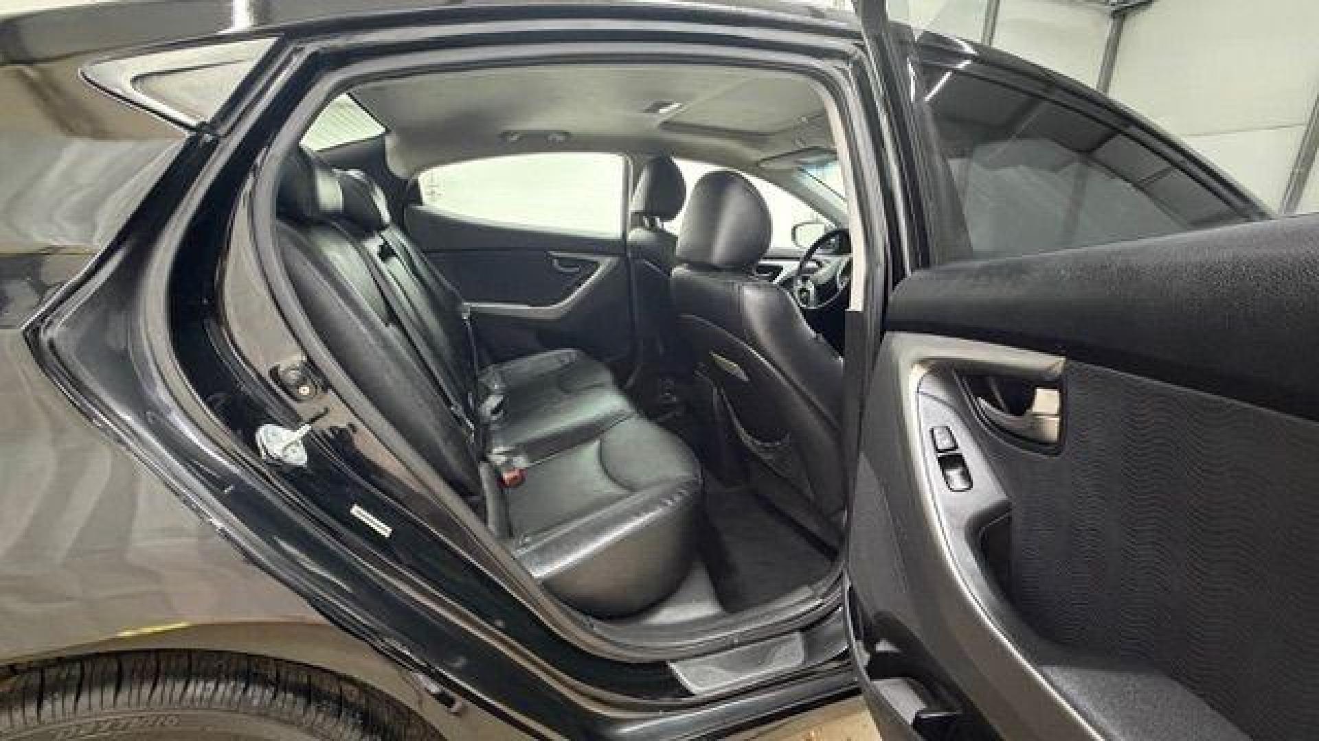 2013 Black Hyundai Elantra GLS A/T (KMHDH4AE3DU) with an 1.8L L4 DOHC 16V engine, 6-Speed Automatic transmission, located at 1806 Veterans Memorial Hwy SW, Austell, GA, 30168, (770) 944-9558, 33.817959, -84.606987 - Photo#16