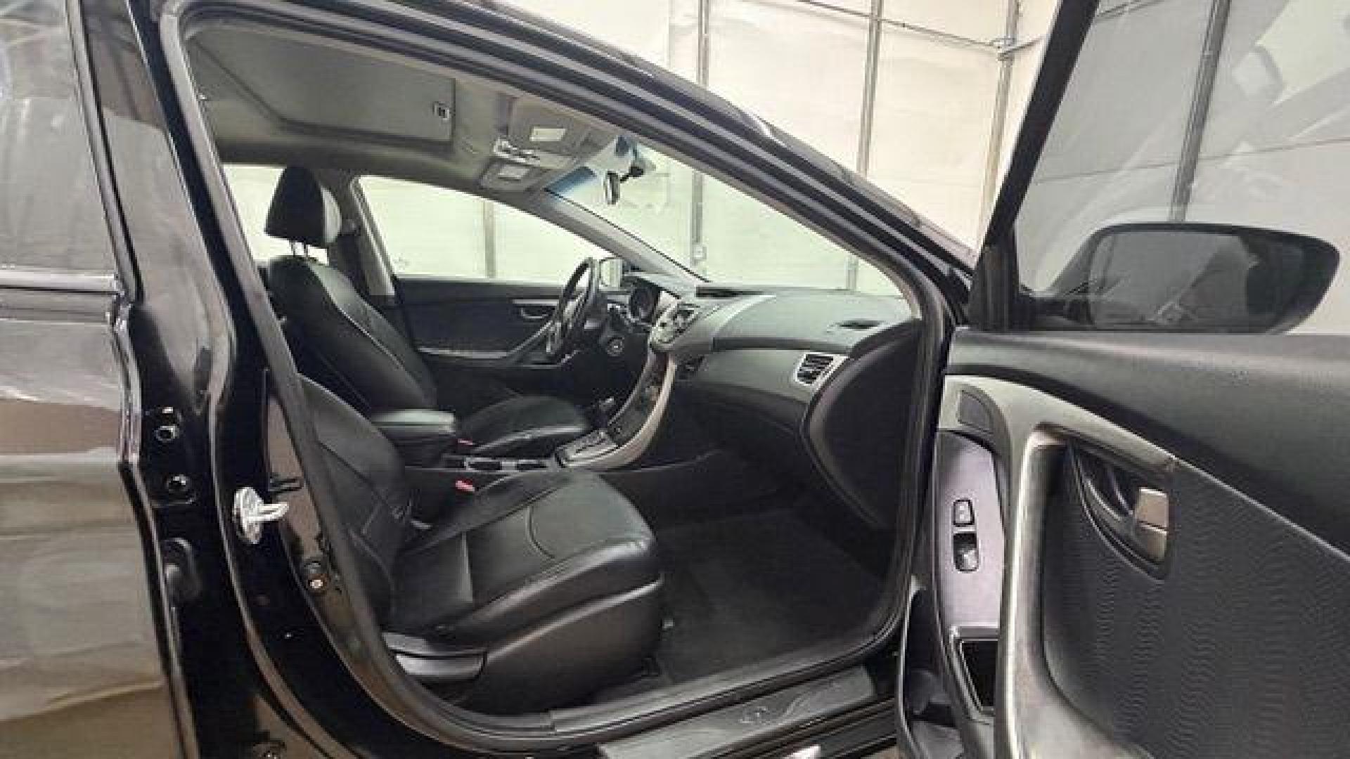 2013 Black Hyundai Elantra GLS A/T (KMHDH4AE3DU) with an 1.8L L4 DOHC 16V engine, 6-Speed Automatic transmission, located at 1806 Veterans Memorial Hwy SW, Austell, GA, 30168, (770) 944-9558, 33.817959, -84.606987 - Photo#17