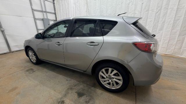 2013 Silver Mazda MAZDA3 i Touring AT 5-Door (JM1BL1L74D1) with an 2.0L L4 DOHC 16V engine, 5-Speed Automatic transmission, located at 1806 Veterans Memorial Hwy SW, Austell, GA, 30168, (770) 944-9558, 33.817959, -84.606987 - Photo#2