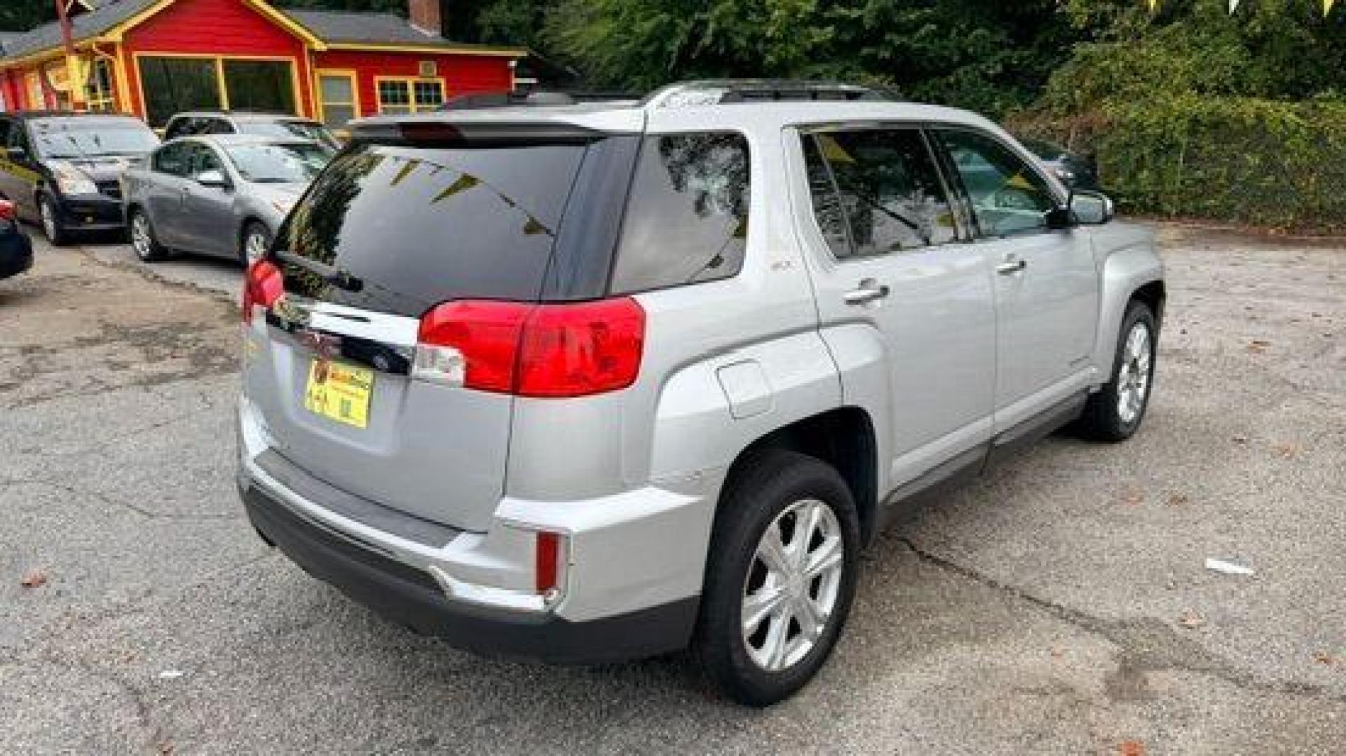2016 Silver GMC Terrain SLT FWD (2GKALPEK4G6) with an 2.4L L4 DOHC 16V engine, 6-Speed Automatic transmission, located at 1806 Veterans Memorial Hwy SW, Austell, GA, 30168, (770) 944-9558, 33.817959, -84.606987 - Photo#3