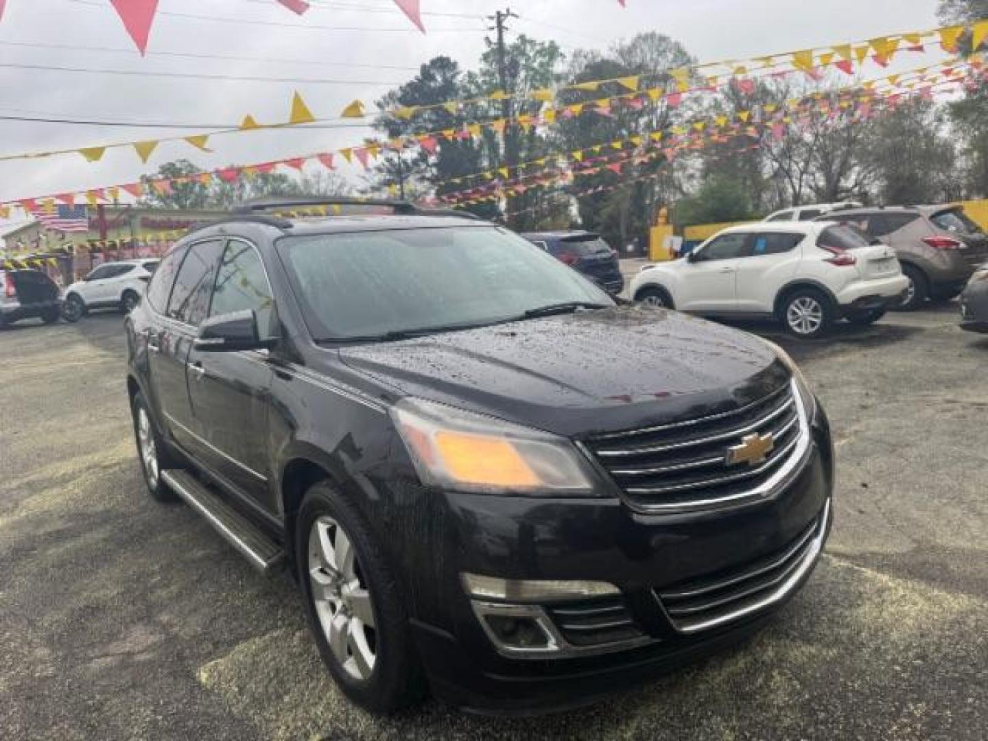 2013 BLACK Chevrolet Traverse LTZ FWD (1GNKRLKD1DJ) with an 3.6L V6 DOHC 24V engine, 6-Speed Automatic transmission, located at 1806 Veterans Memorial Hwy SW, Austell, GA, 30168, (770) 944-9558, 33.817959, -84.606987 - Photo#2