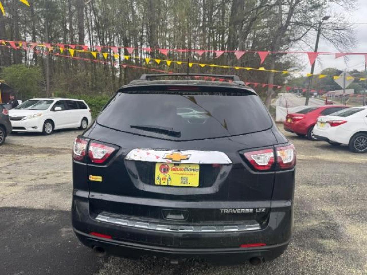 2013 BLACK Chevrolet Traverse LTZ FWD (1GNKRLKD1DJ) with an 3.6L V6 DOHC 24V engine, 6-Speed Automatic transmission, located at 1806 Veterans Memorial Hwy SW, Austell, GA, 30168, (770) 944-9558, 33.817959, -84.606987 - Photo#4