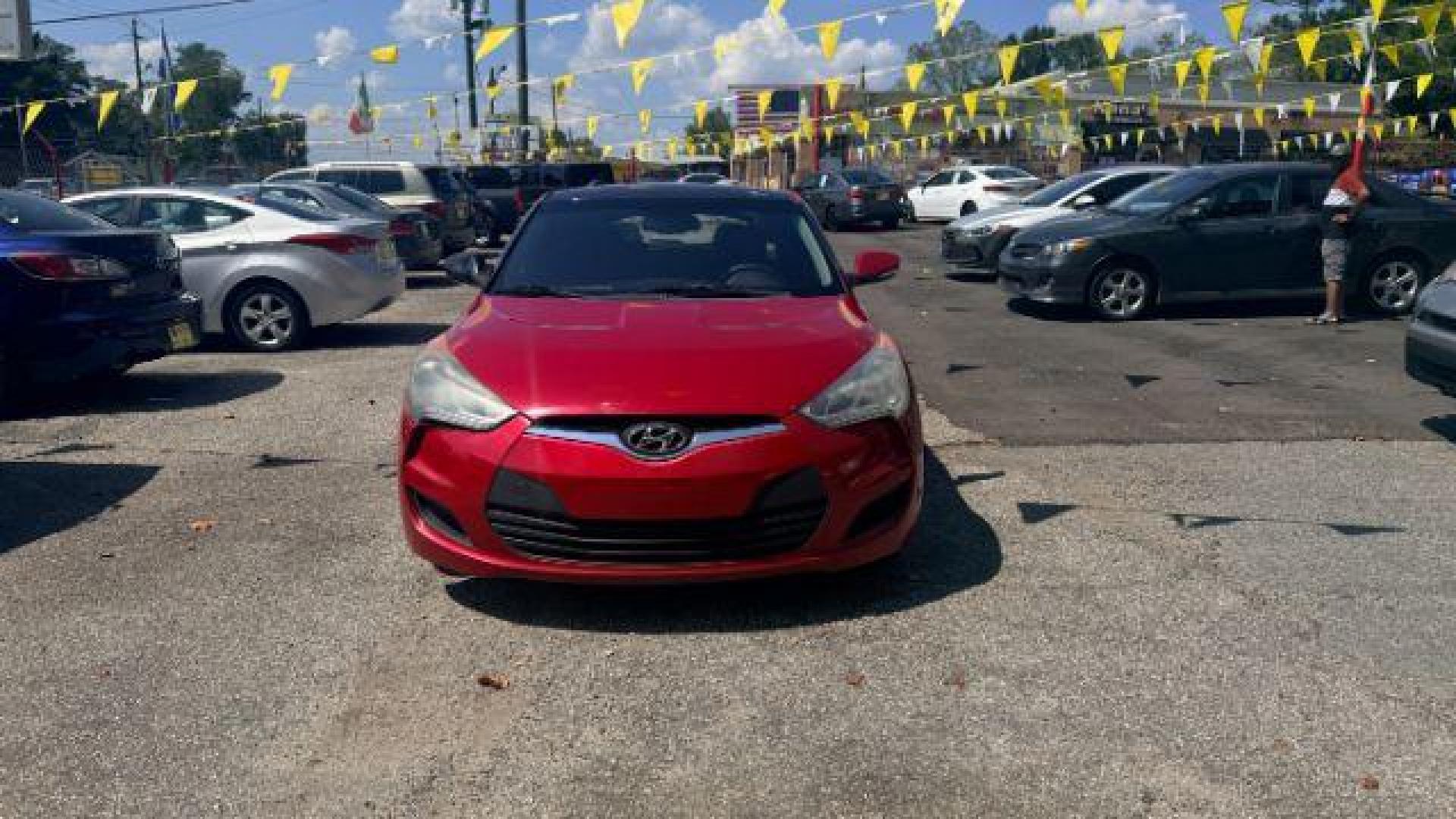 2013 Red Hyundai Veloster Base (KMHTC6ADXDU) with an 1.6L L4 DOHC 16V engine, 6-Speed Automatic transmission, located at 1806 Veterans Memorial Hwy SW, Austell, GA, 30168, (770) 944-9558, 33.817959, -84.606987 - Photo#1