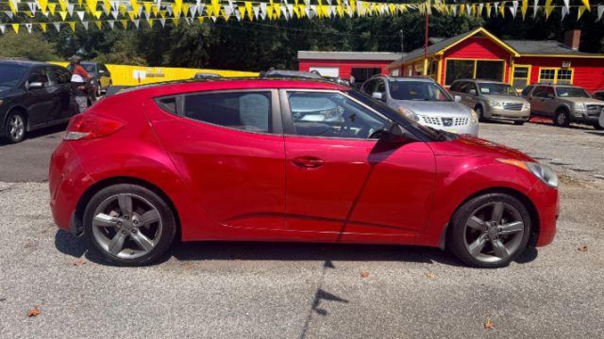 2013 Red Hyundai Veloster Base (KMHTC6ADXDU) with an 1.6L L4 DOHC 16V engine, 6-Speed Automatic transmission, located at 1806 Veterans Memorial Hwy SW, Austell, GA, 30168, (770) 944-9558, 33.817959, -84.606987 - Photo#2