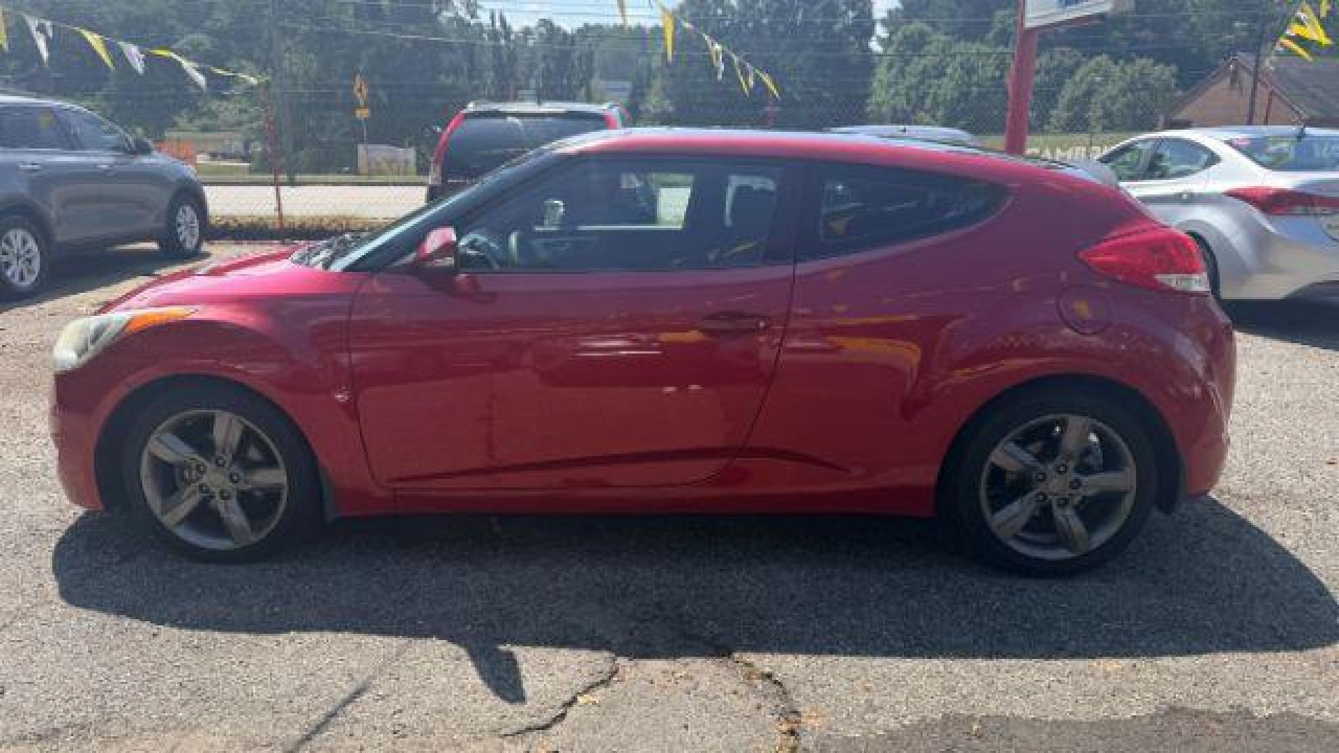 2013 Red Hyundai Veloster Base (KMHTC6ADXDU) with an 1.6L L4 DOHC 16V engine, 6-Speed Automatic transmission, located at 1806 Veterans Memorial Hwy SW, Austell, GA, 30168, (770) 944-9558, 33.817959, -84.606987 - Photo#4