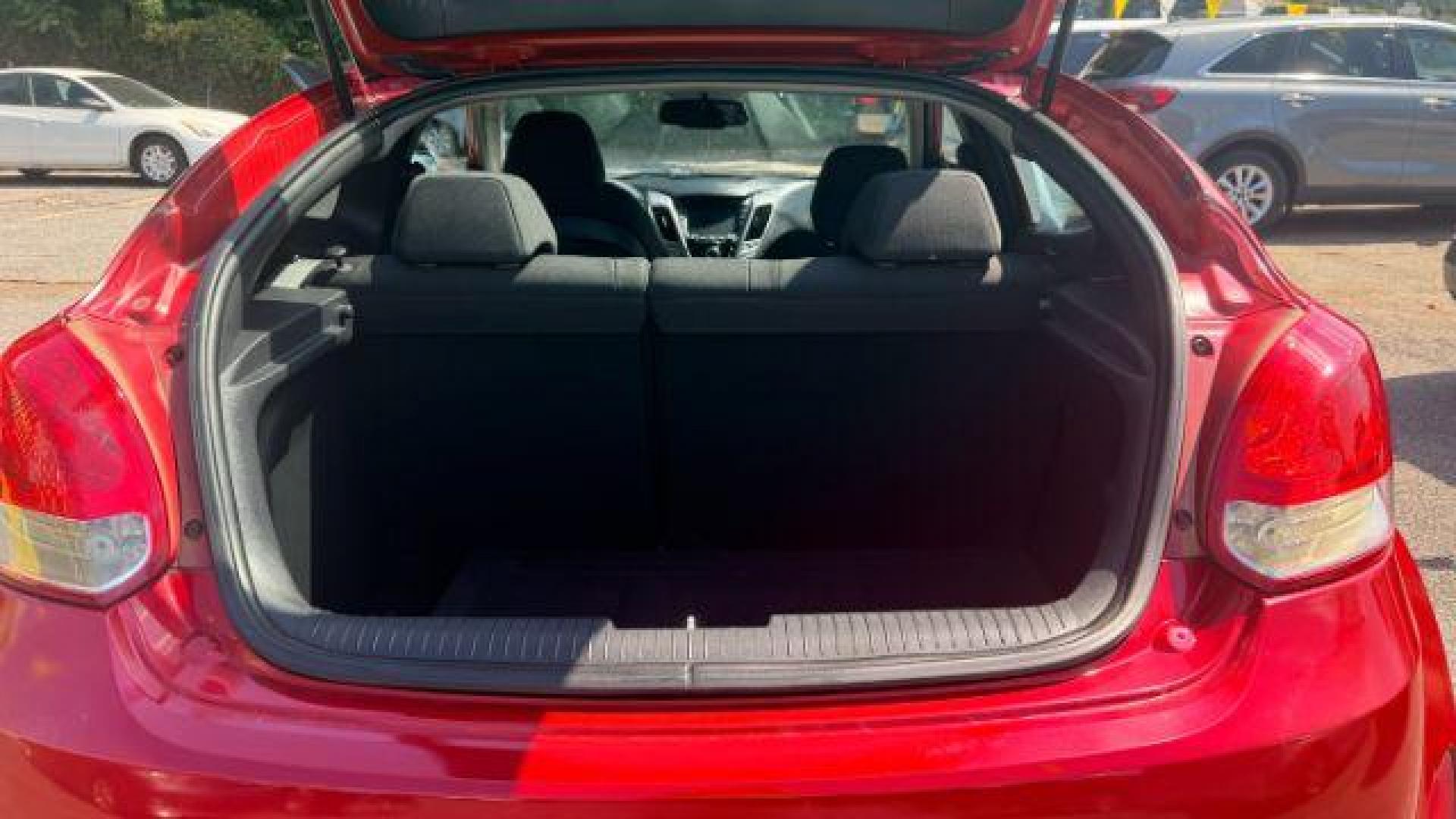 2013 Red Hyundai Veloster Base (KMHTC6ADXDU) with an 1.6L L4 DOHC 16V engine, 6-Speed Automatic transmission, located at 1806 Veterans Memorial Hwy SW, Austell, GA, 30168, (770) 944-9558, 33.817959, -84.606987 - Photo#6