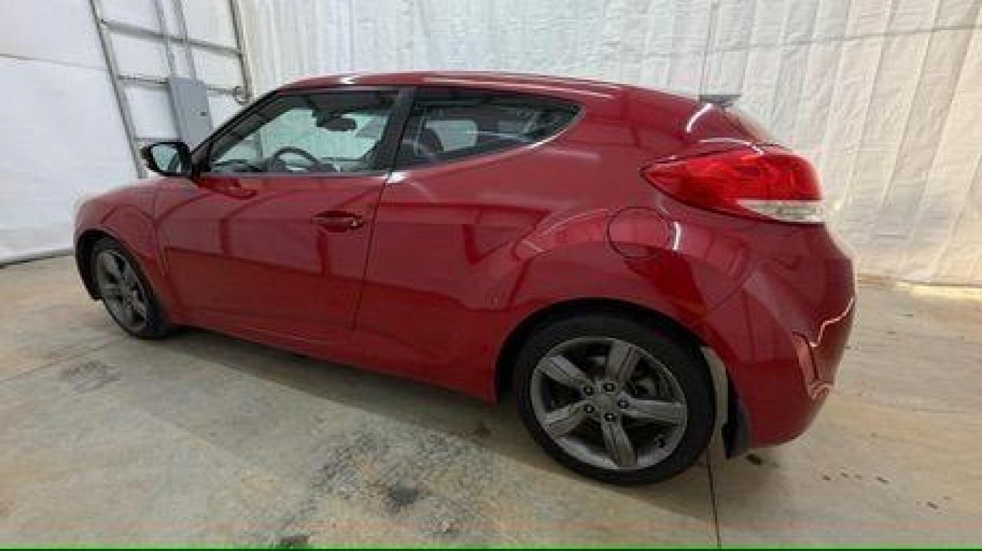 2013 Red Hyundai Veloster Base (KMHTC6ADXDU) with an 1.6L L4 DOHC 16V engine, 6-Speed Automatic transmission, located at 1806 Veterans Memorial Hwy SW, Austell, GA, 30168, (770) 944-9558, 33.817959, -84.606987 - Photo#2
